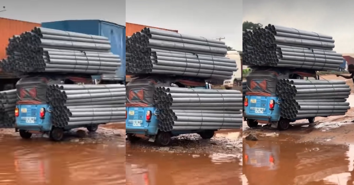 Keke rider struggles on damaged road after overloading his tricycle with aluminum rods (VIDEO)