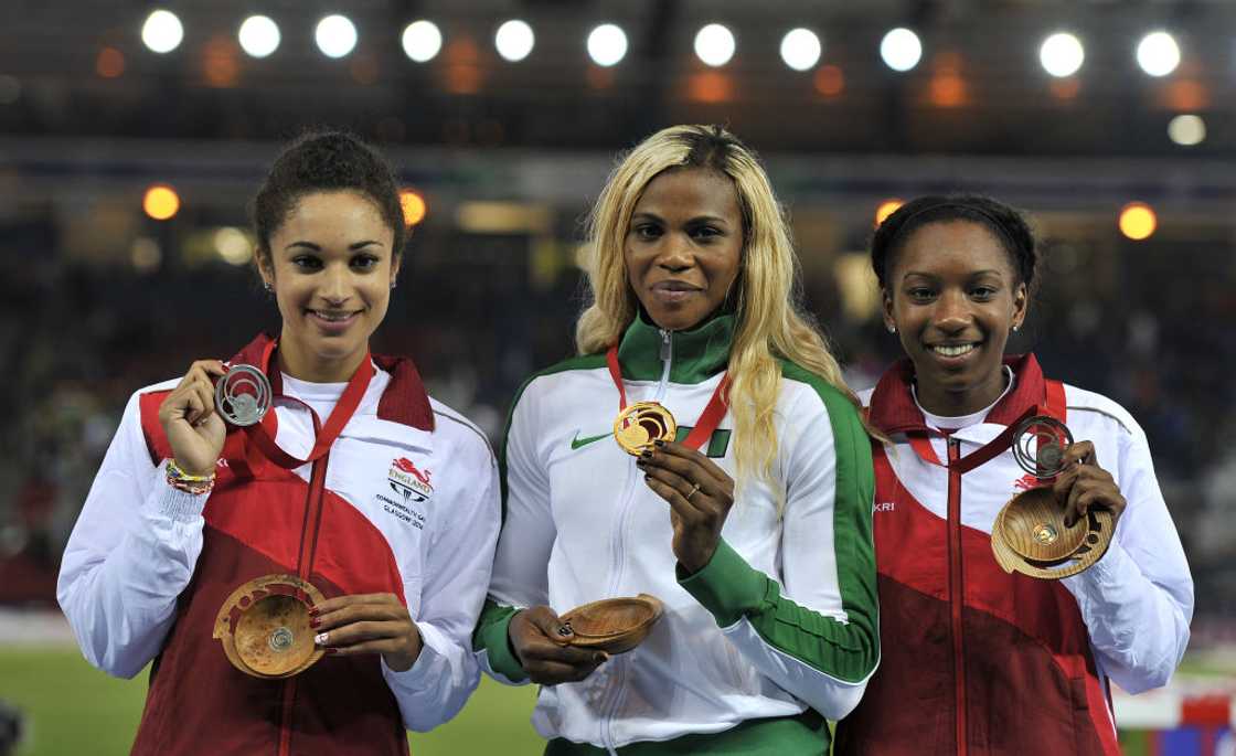 Blessing Okagbare (Centre), celebrates a podium finish at the 2014 Commonwealth Games