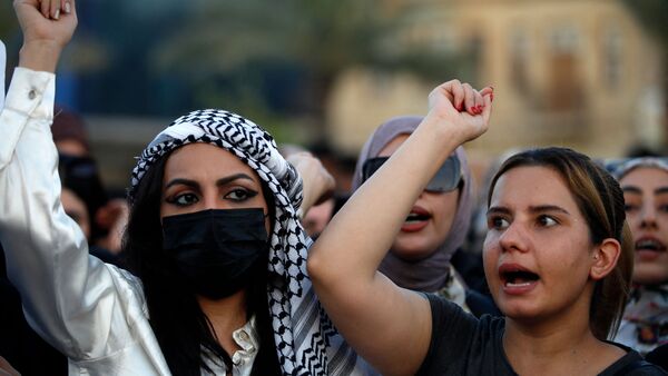 Iraqi women demonstrate against underage marriage in Tahrir Square in central Baghdad on August 8, 2024, amid parliamentary discussions over a proposed amendment to the Iraqi Personal Status Law. Rights advocates are alarmed by a bill introduced to Iraq's parliament that, they fear, would roll back women's rights and increase underage marriage in the deeply patriarchal society. (Photo by AHMAD AL-RUBAYE / AFP)