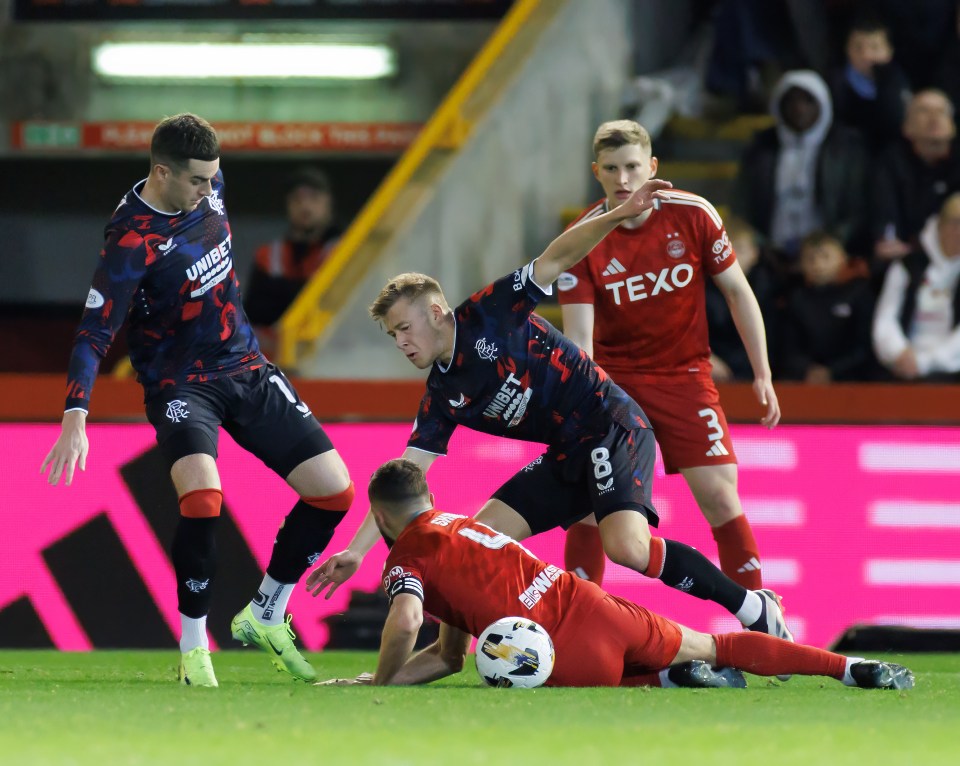 Connor Barron battles with Graeme Shinnie at Pittodrie