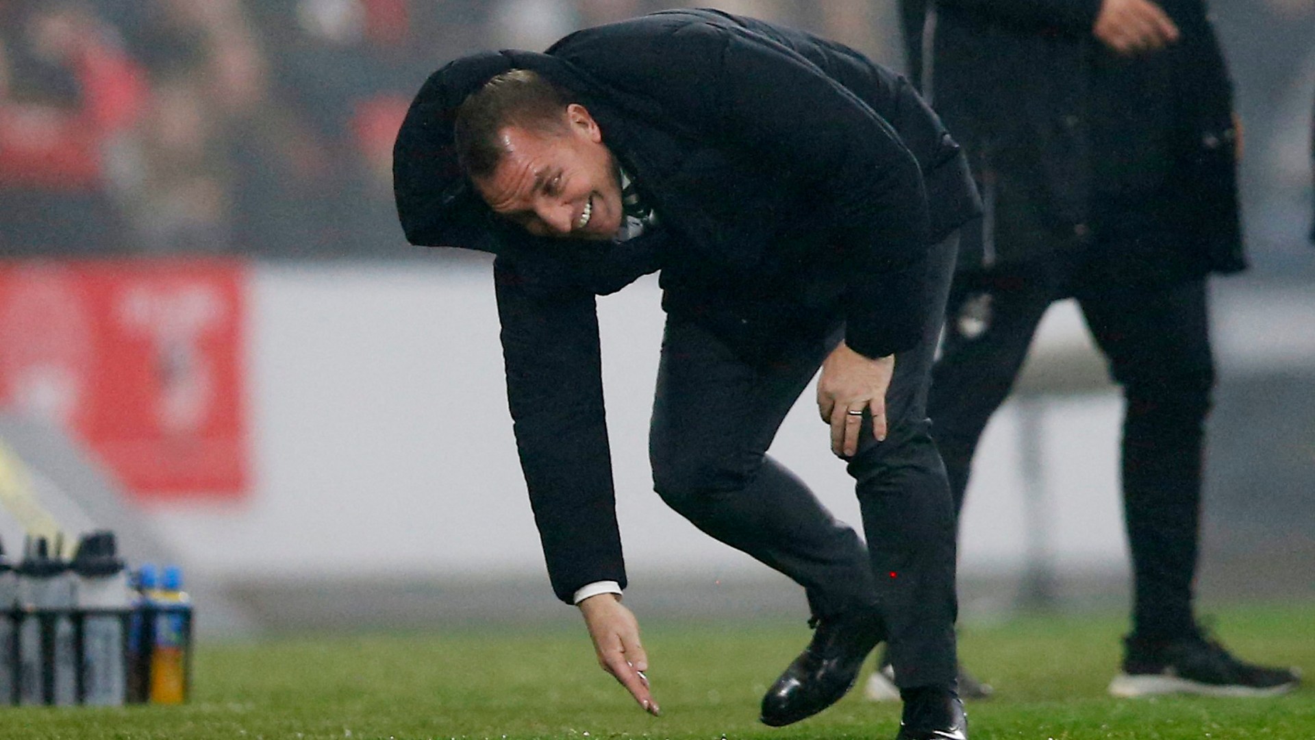 Embarassing moment Celtic boss Brendan Rodgers falls in the mud at Hampden then gets BOOKED