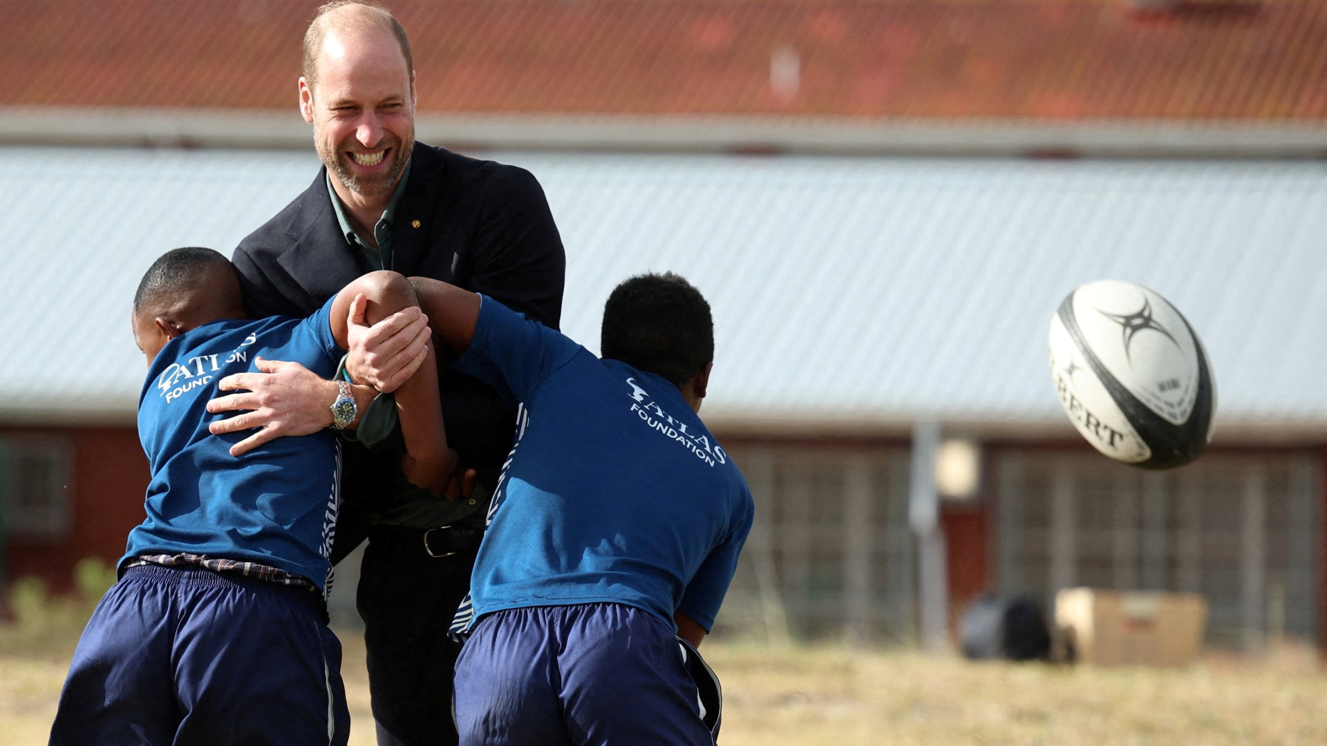 Prince William launches South Africa trip playing touch rugby with kids — and 'The Beast'