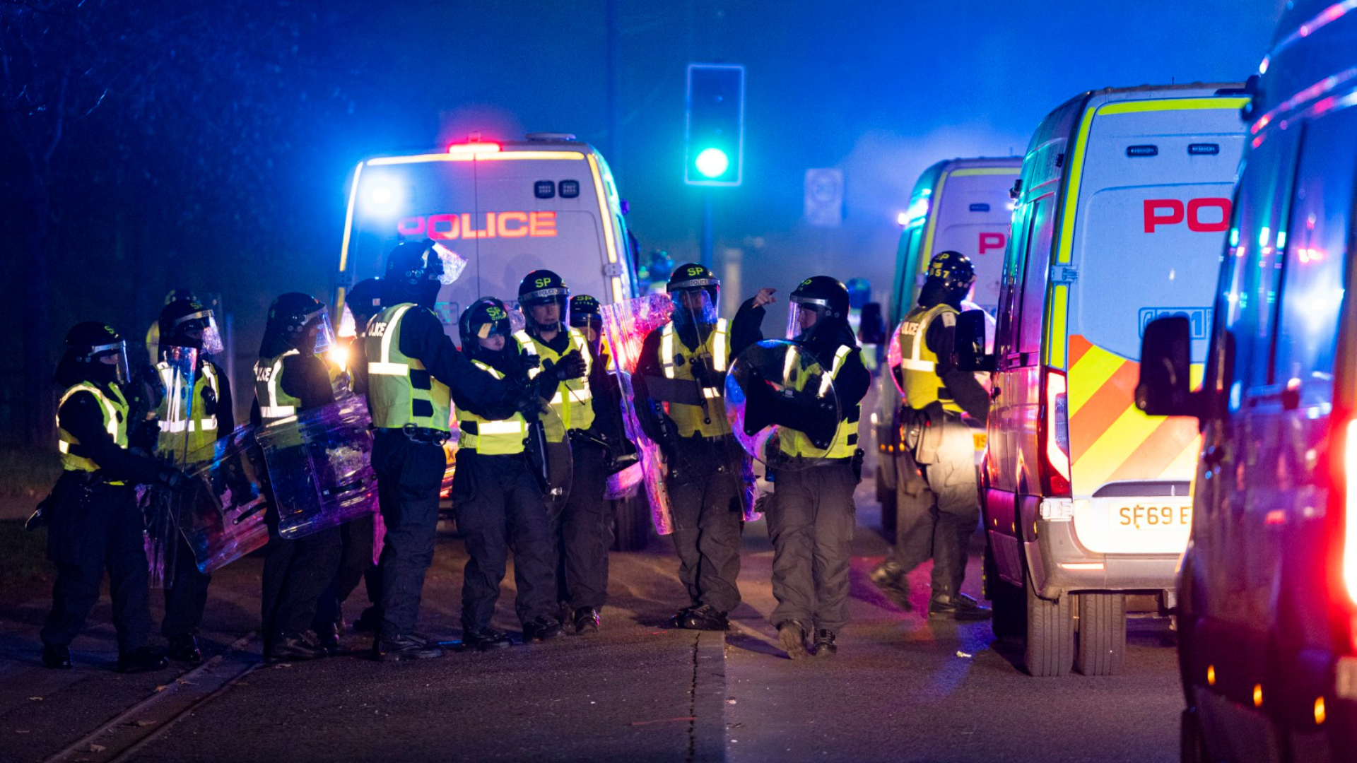 Shocking moment Bonfire Night yobs launch glass bottles at riot cops as terrified locals brand Scots city a 'war zone'