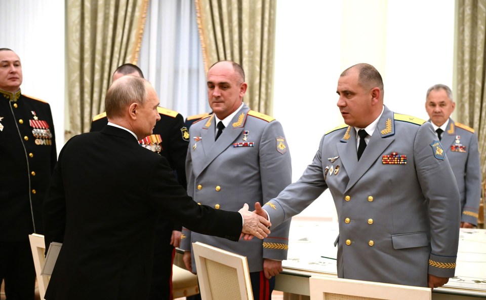 Klimenko, centre, during a meeting with Vladimir Putin