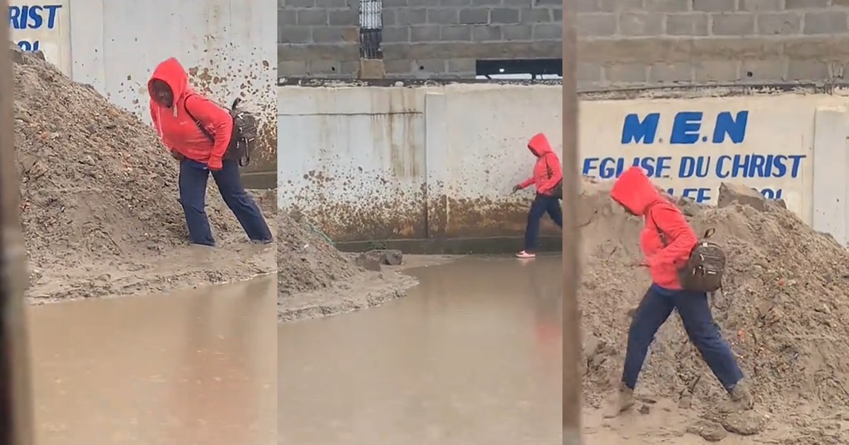 Lady gets stúck in mud, loses slipper while avoiding muddy water on street (WATCH)