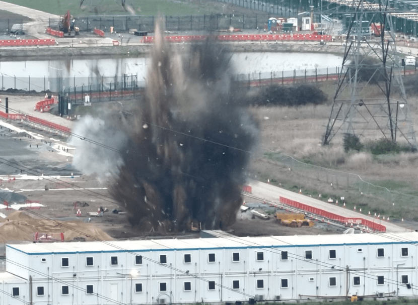 Watch dramatic moment WW2 bomb weighing 39 STONE is blown to smithereens as squads swarm street with trains axed