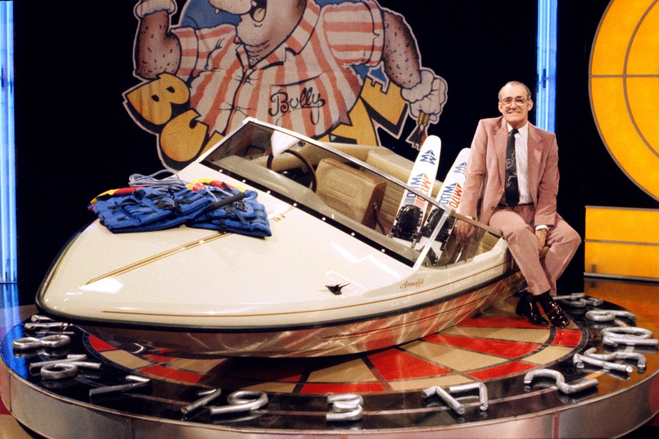 Former host Jim Bowen with a prized speedboat on the show