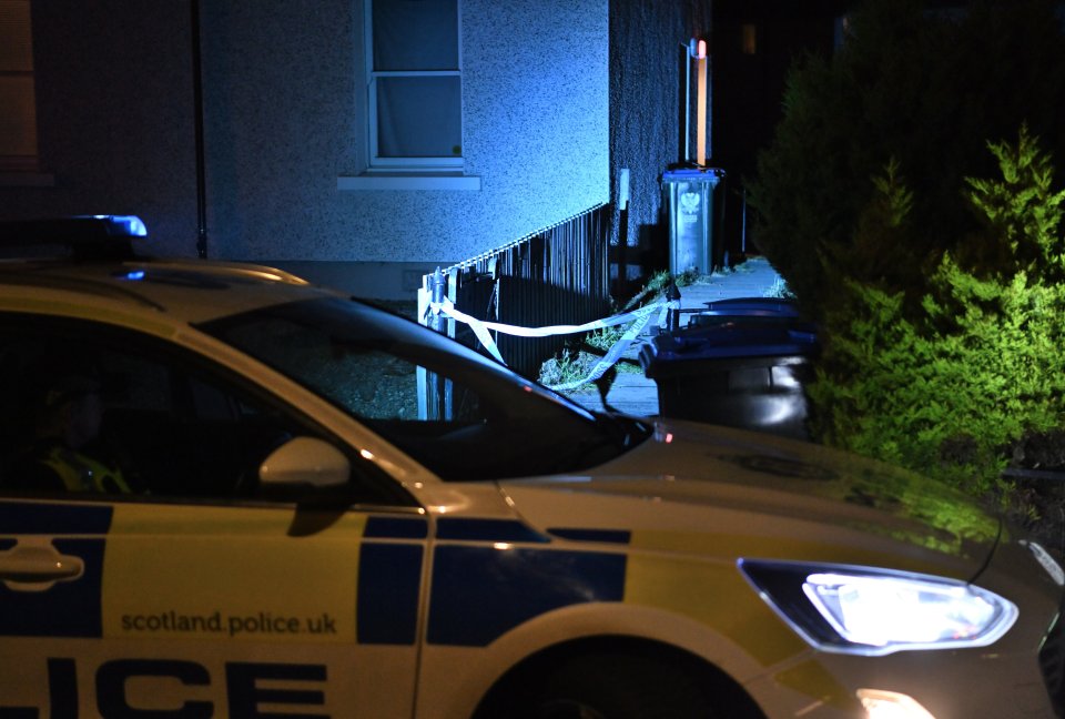 Officers stood guard at the scene on Knowelea Place