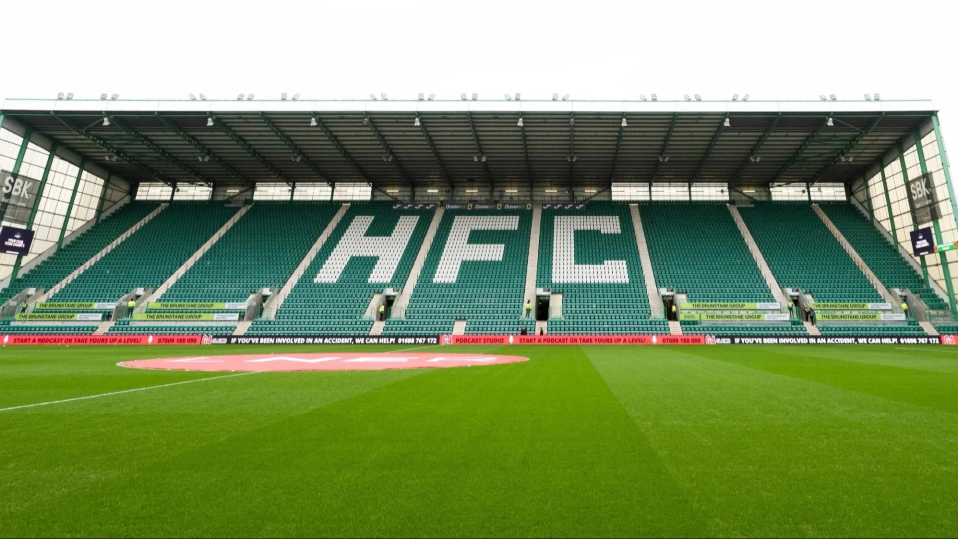 Shock moment Hibs star has to be DRAGGED AWAY from arguing with his own fans