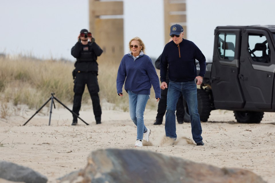 At one point, Biden was seen to repeatedly wobble and stumble through the sand