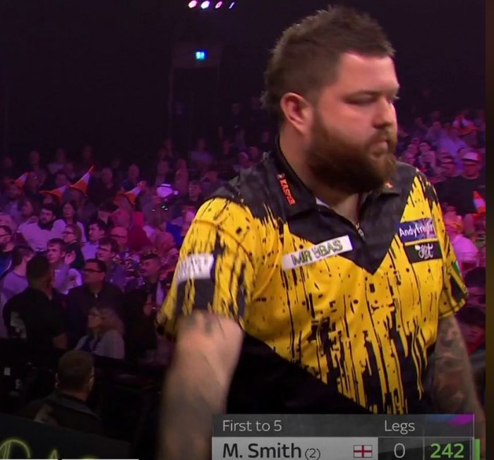 Smith looked away as he threw his third dart