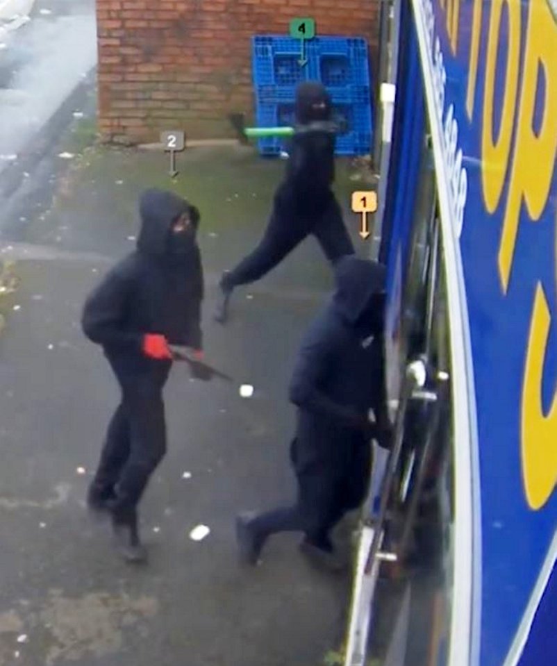 CCTV captures the armed gang attacking the computer shop on Bertram Road in Smethwick