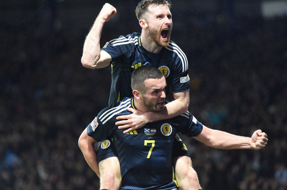 Ralston celebrates with John McGinn after he netted the winner