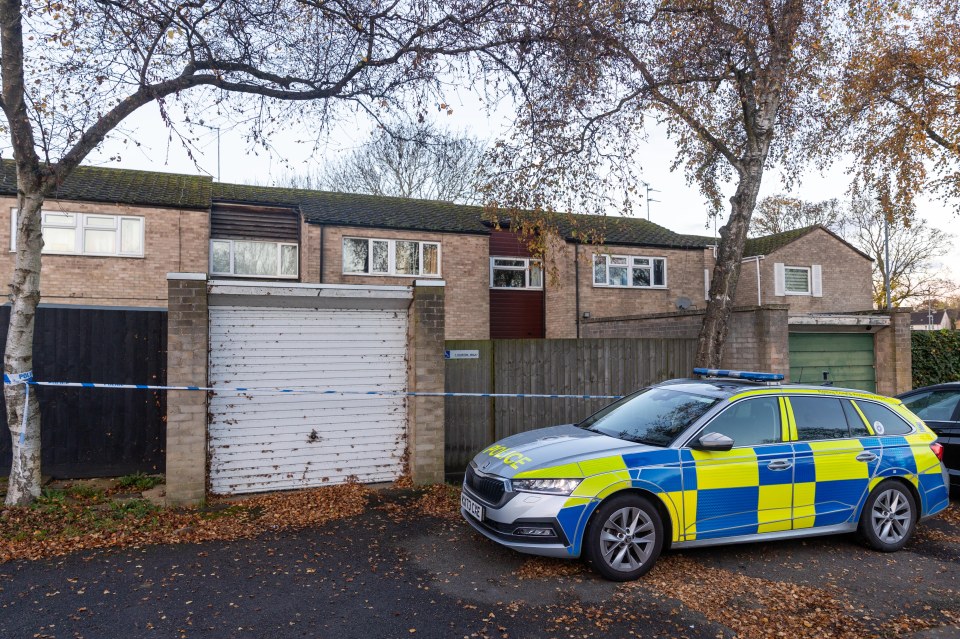 Police remain guarding the scene on Sturton Walk, Corby, this morning