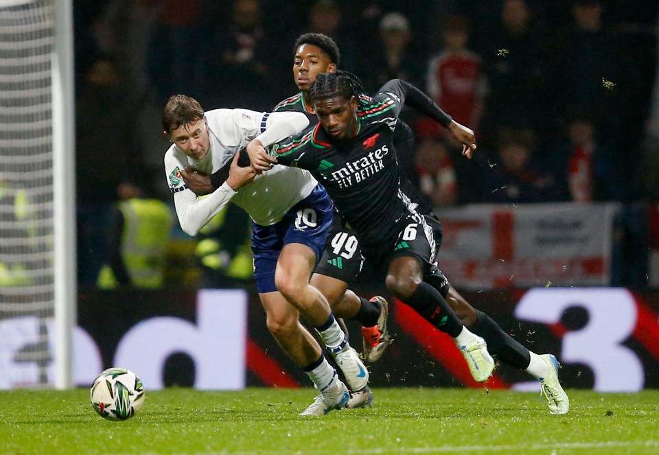 The defender (right) made his Gunners bow in the Carabao Cup at Deepdale