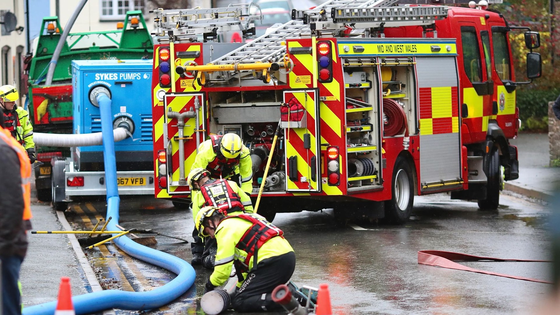 Moment floodwater engulfs town in seconds with frantic rescuers crying 'get back' as Storm Bert wreaks havoc