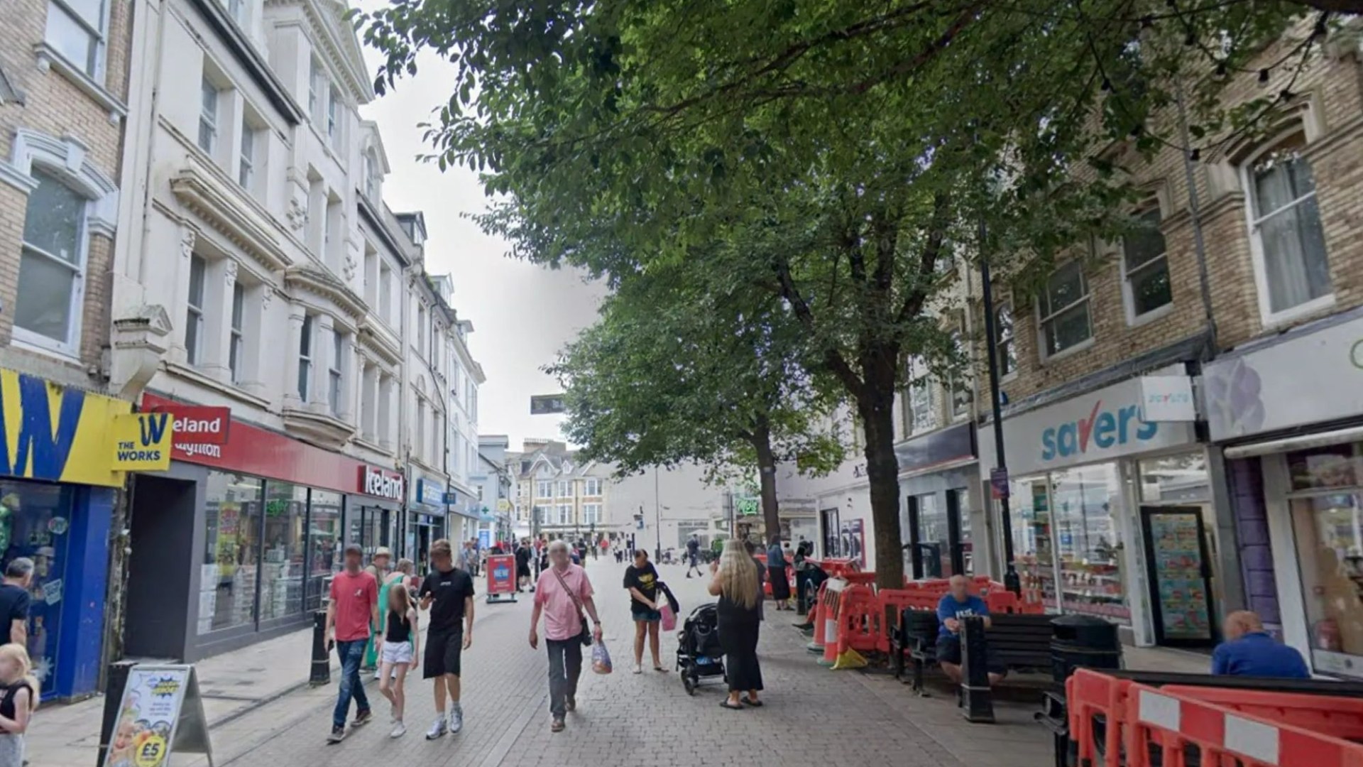 Man in 30s fighting for his life after 'corrosive substance' attack in seaside town centre as 3 men & 2 women arrested