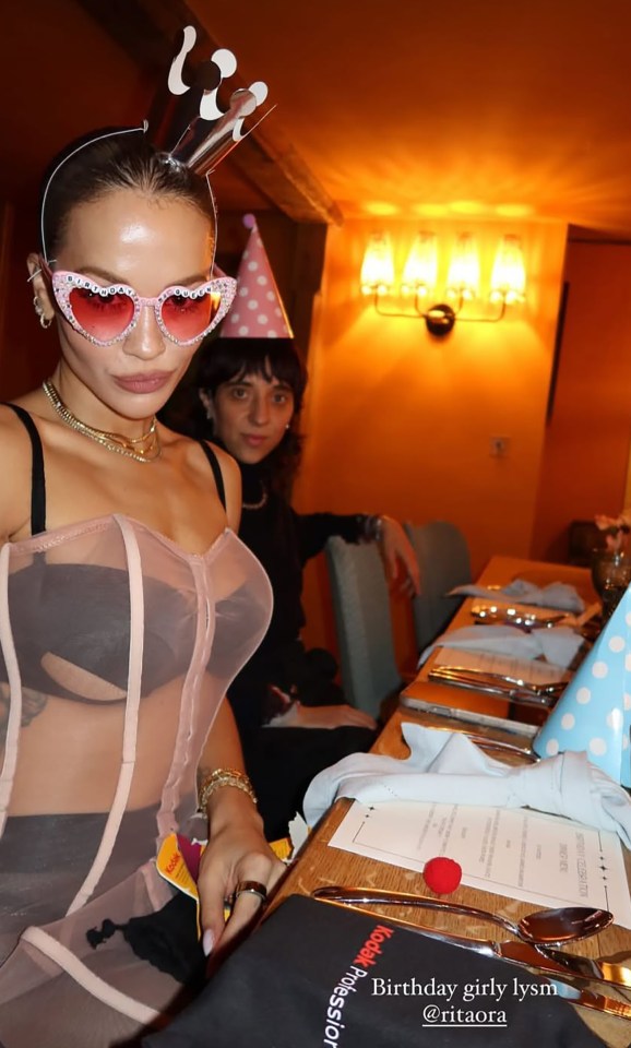 She donned a see-through dress as she hosted an intimate dinner