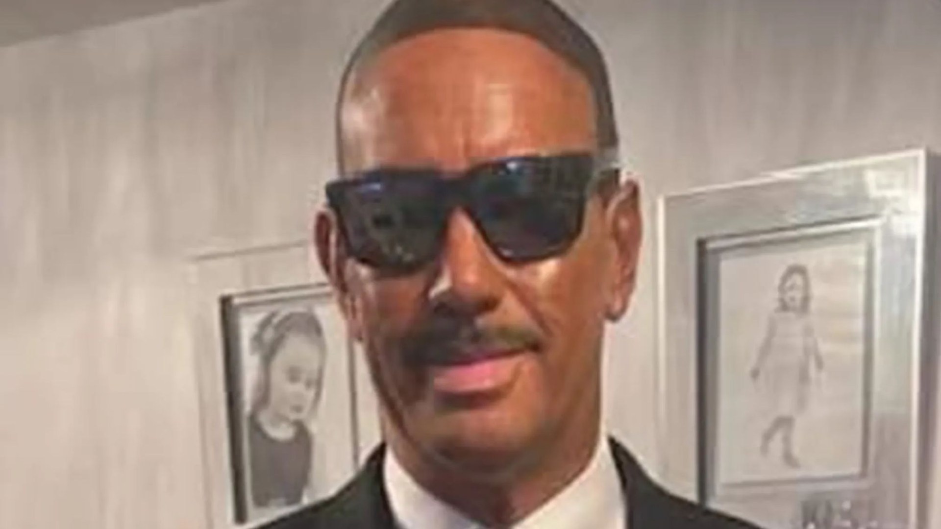 Company boss sparks outrage after 'blacking up' to go to firm's Christmas party as Will Smith