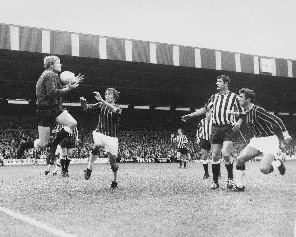 McNamee keeps guard as Newcastle United goalkeeper Willie McFaul jumps for the ball