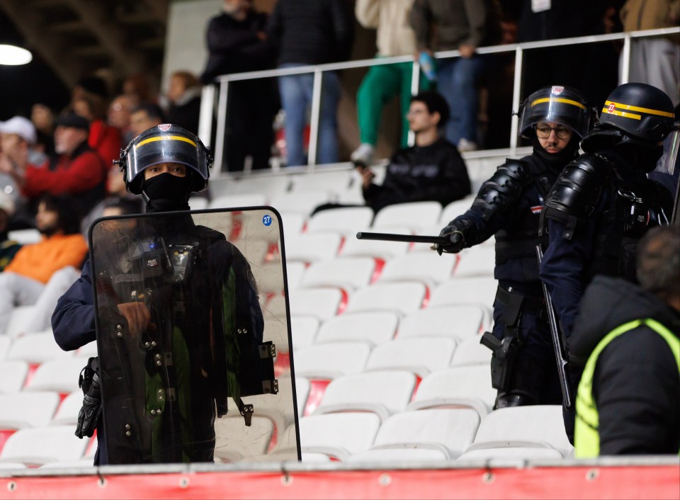 French riot police move Rangers fans on