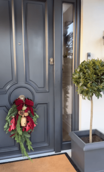 The door has a matching wreath