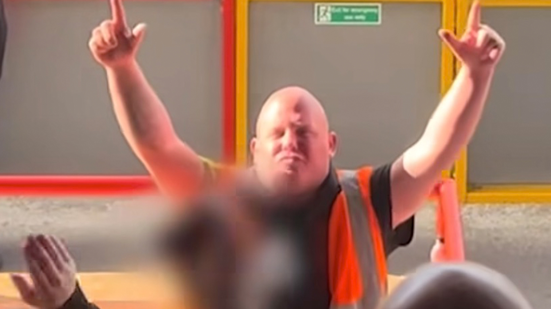 Brilliant moment steward who's the spitting image of darts legend is serenaded by football fans