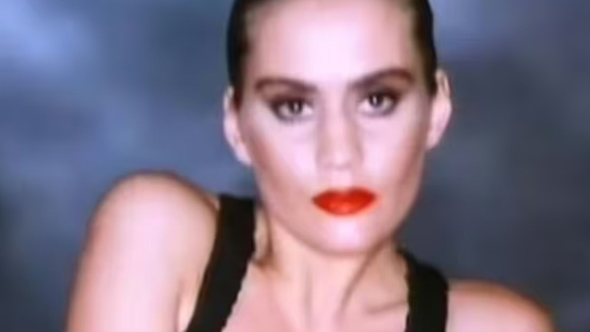 Wife of one of UK's most popular TV presenters looks incredible in classic pop music video - but can you tell who it is?