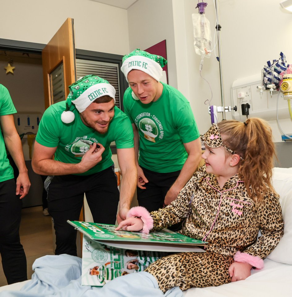 James Forrest and Callum McGregor with Amelia Ruddoch, aged 7