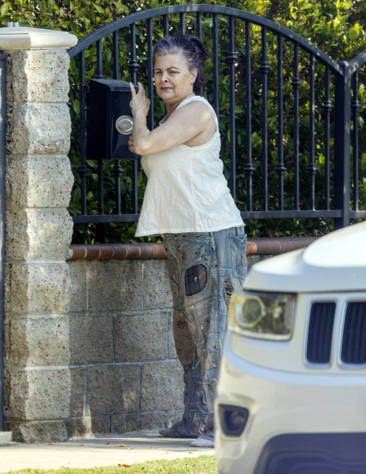 The actress looked relaxed in baggy distressed jeans and a white top