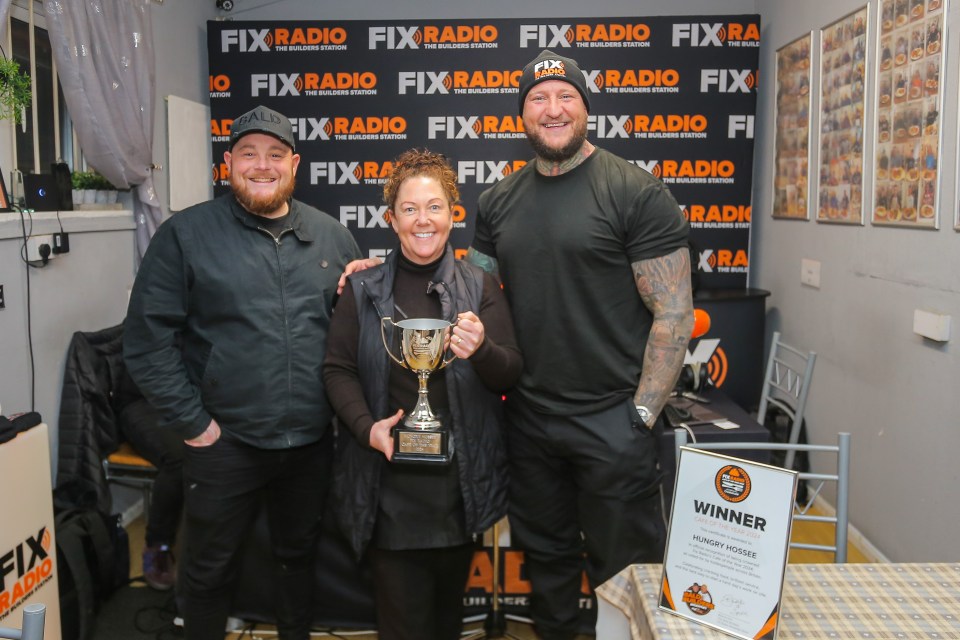 Shelaine Crabtree (centre) celebrated with the team from the Bald Builders