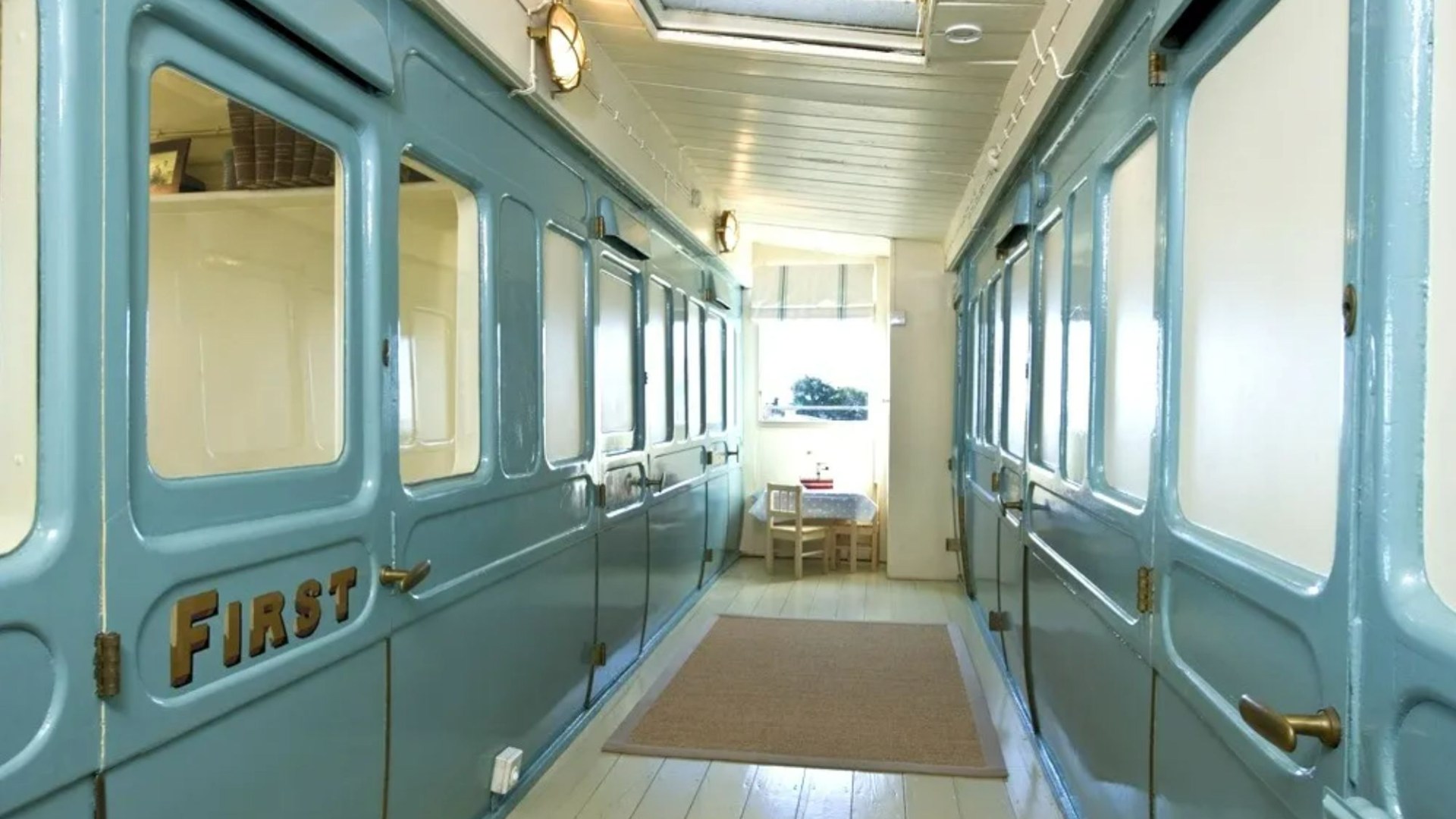 You can stay in a converted train carriage right on the English coastline with beds in first class