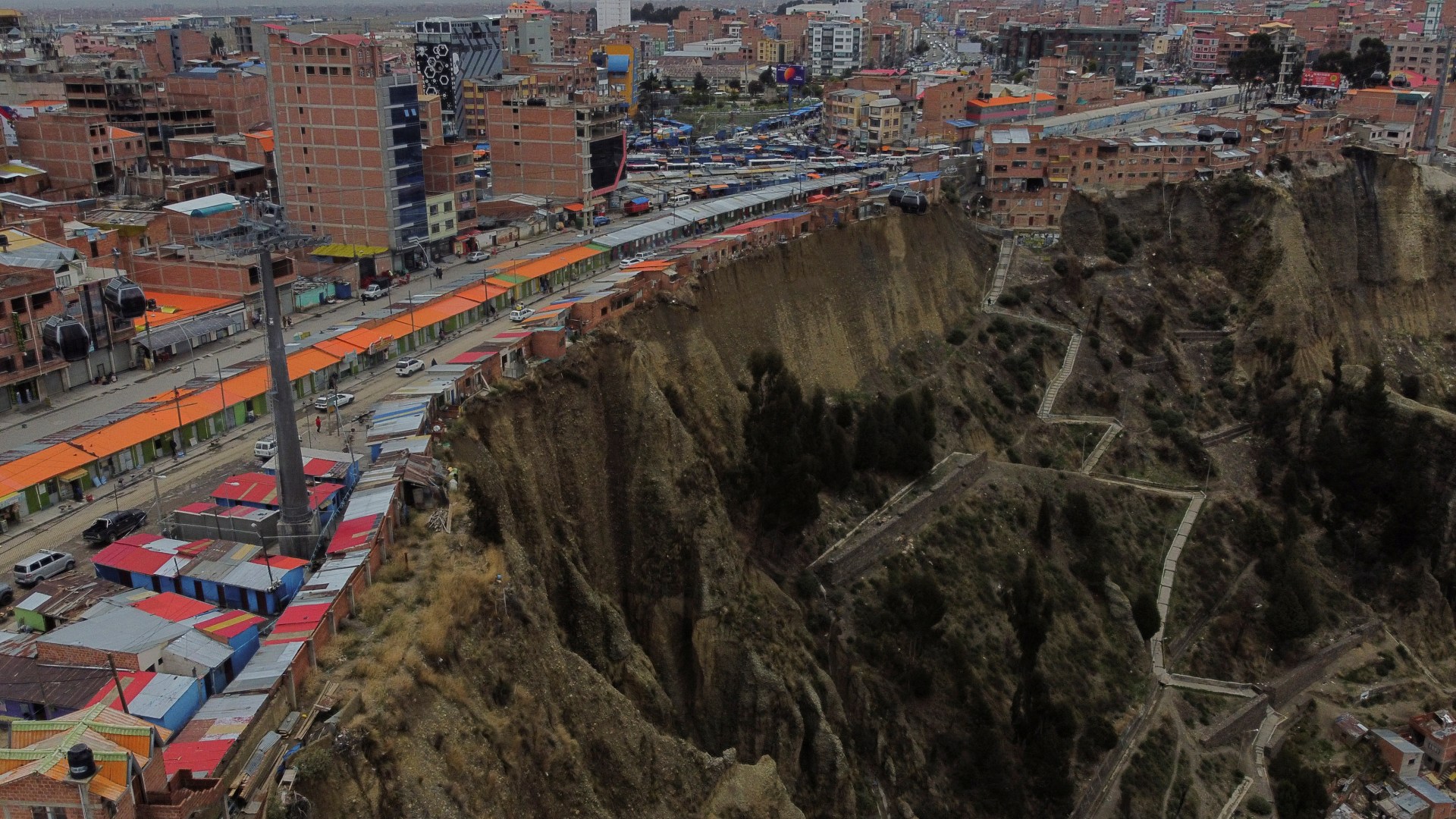 World’s scariest street dubbed ‘the Suicide Homes’ by locals inches away from plunging onto razor rocks down 200ft cliff