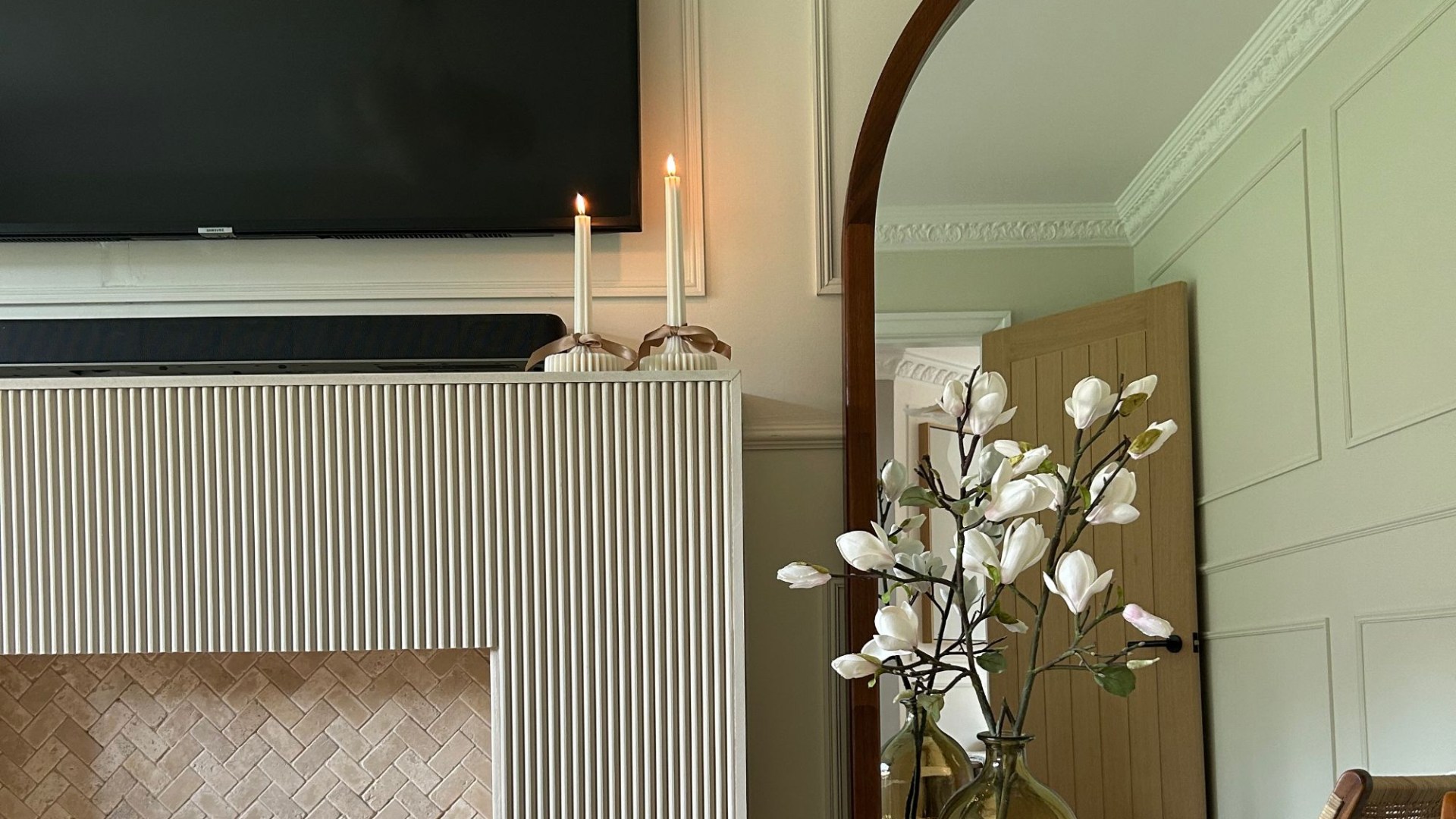 I saved £562 panelling over my damaged fireplace with DIY - a £38 paint made it really pop