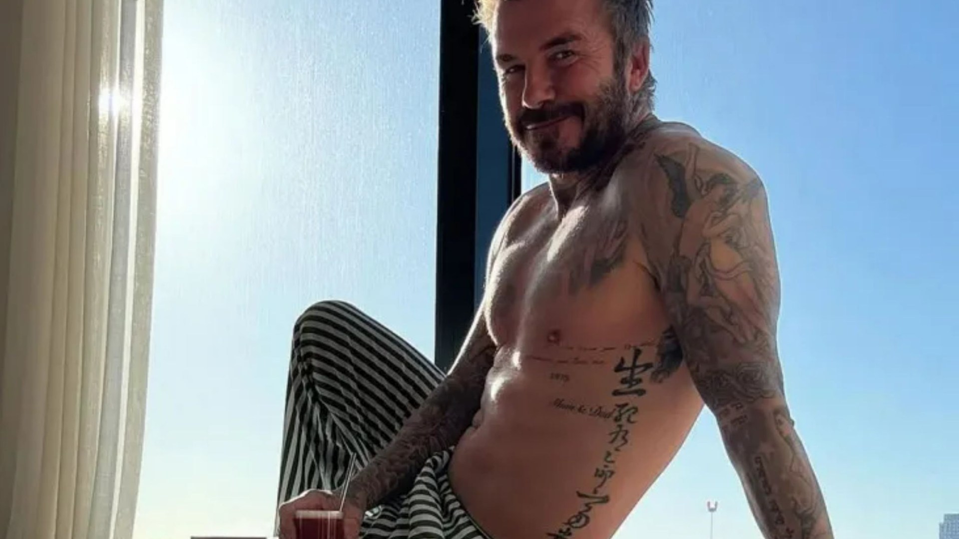 David Beckham, 49, shows off his ripped physique in new topless snap - sending fans wild