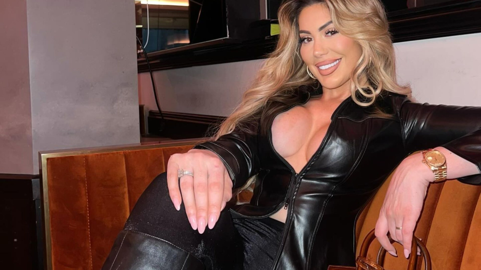 Chloe Ferry dares to go braless in plunging leather shirt for festive night out