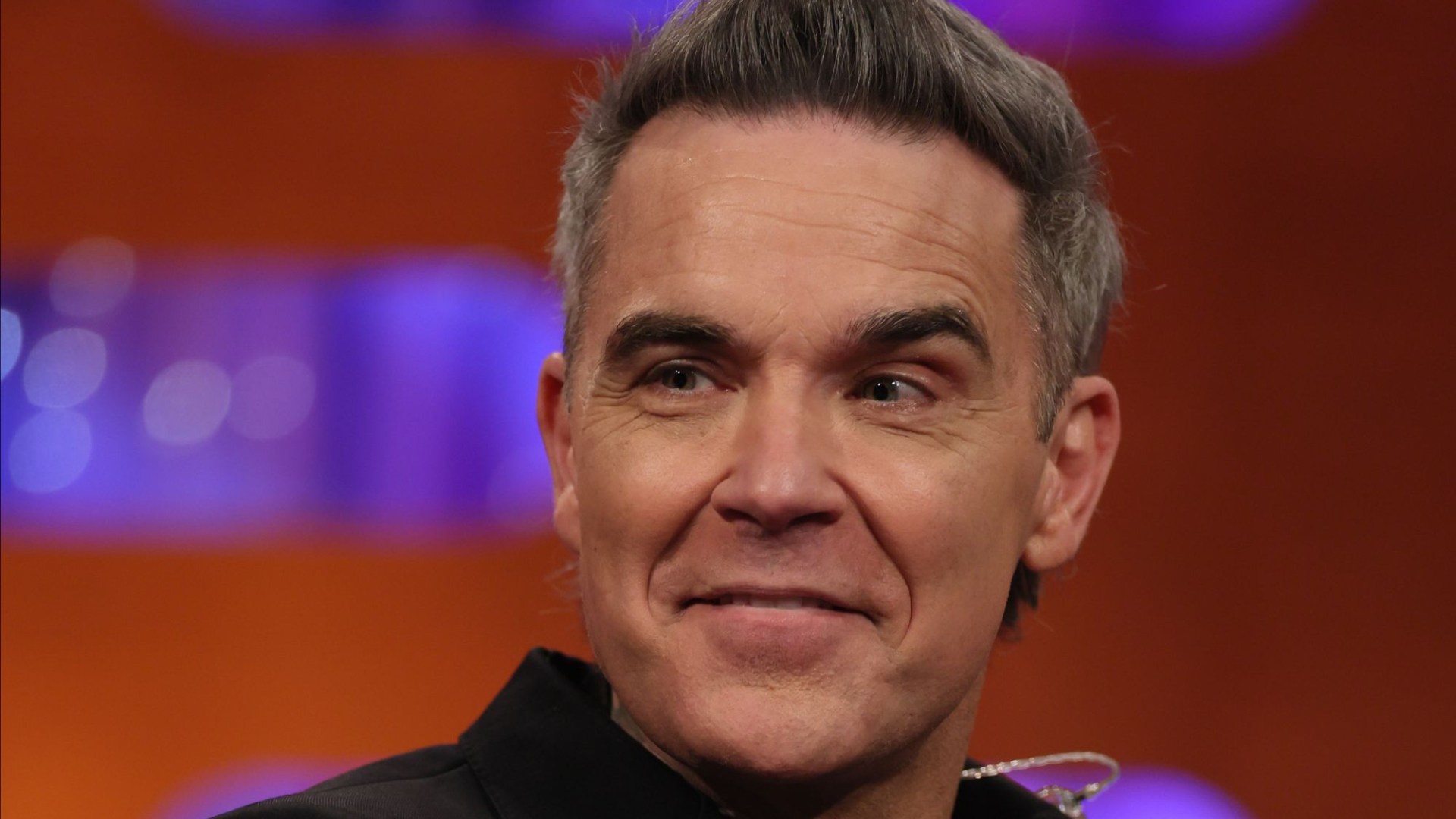 Robbie Williams fans baffled as he appears on TV just hours after performing in Australia for New Year