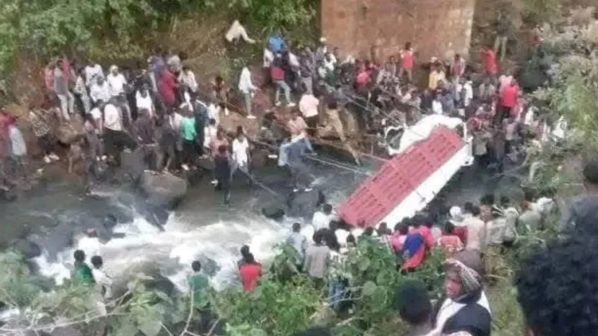 At least 71 killed in devastating bus crash after overloaded vehicle packed with WEDDING guests plunges into river