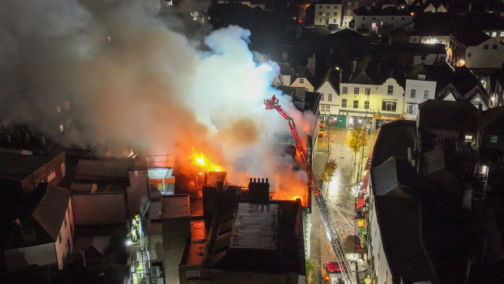 Flames engulf old Debenhams sending smoke billowing into the air as dozens of firefighters battle blaze