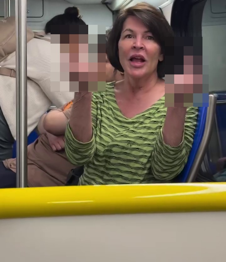 Shock moment ‘racist’ traveller launches foul rant at photographer & family before she’s kicked off plane transfer bus