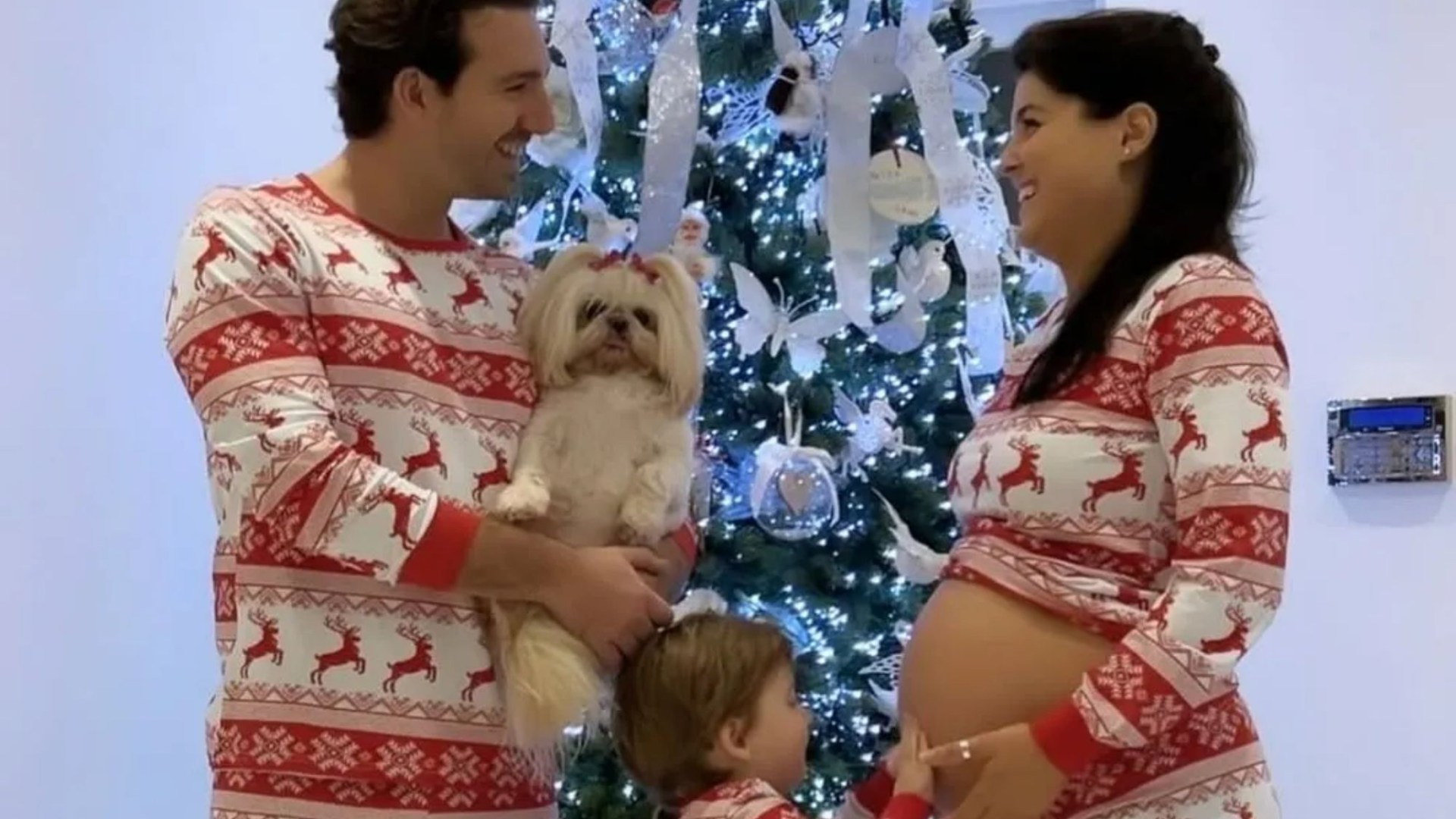 Storm Huntley shows off growing baby bump as she poses with husband Kerr and son for their last Christmas as a trio