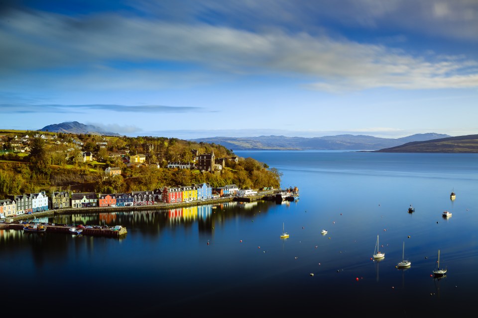 Long exposure photo of colorful houses on a waterfront in Tobermory, Isle of Mull.