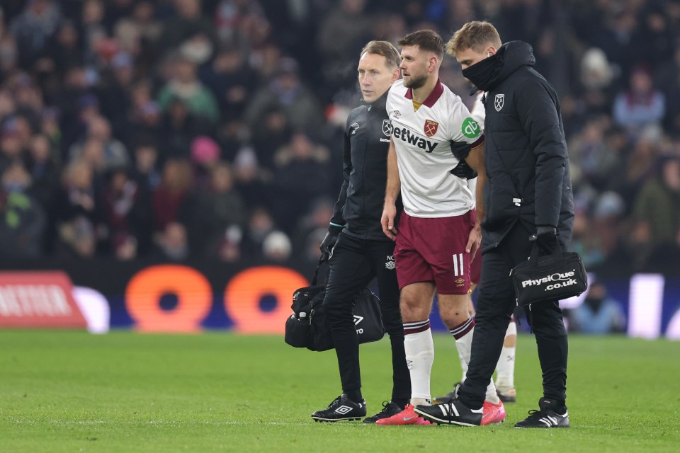 Niclas Fullkrug of West Ham United being assisted off the field with an injury.