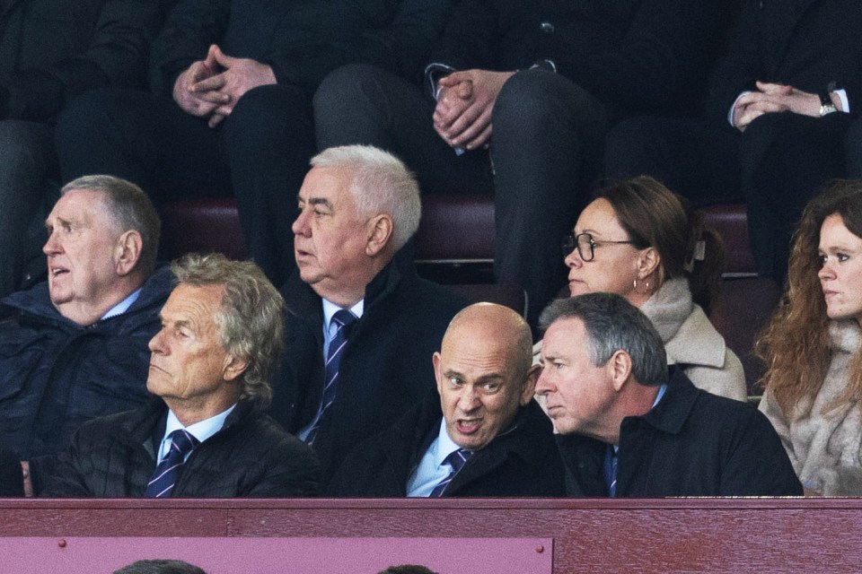 Rangers Chairman Fraser Thornton and others in the stands at a football match.