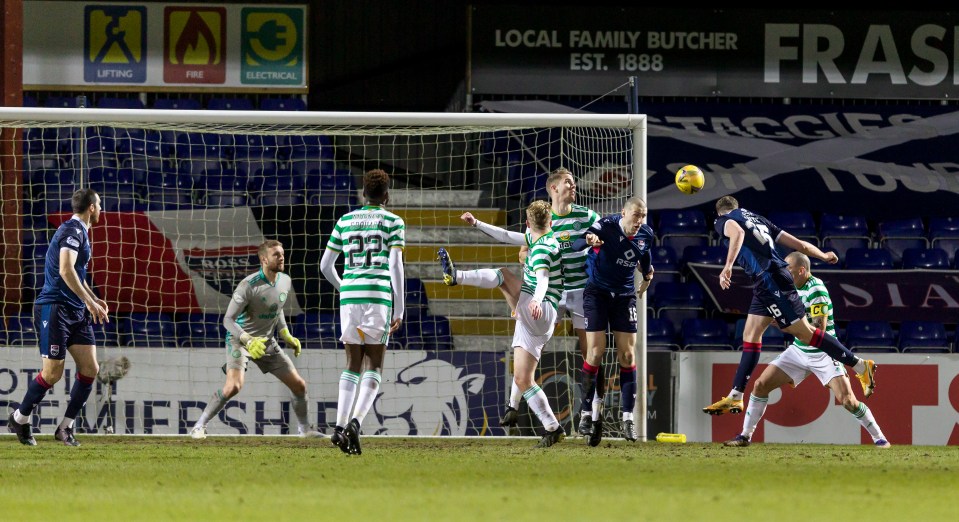 Soccer players vying for a goal.