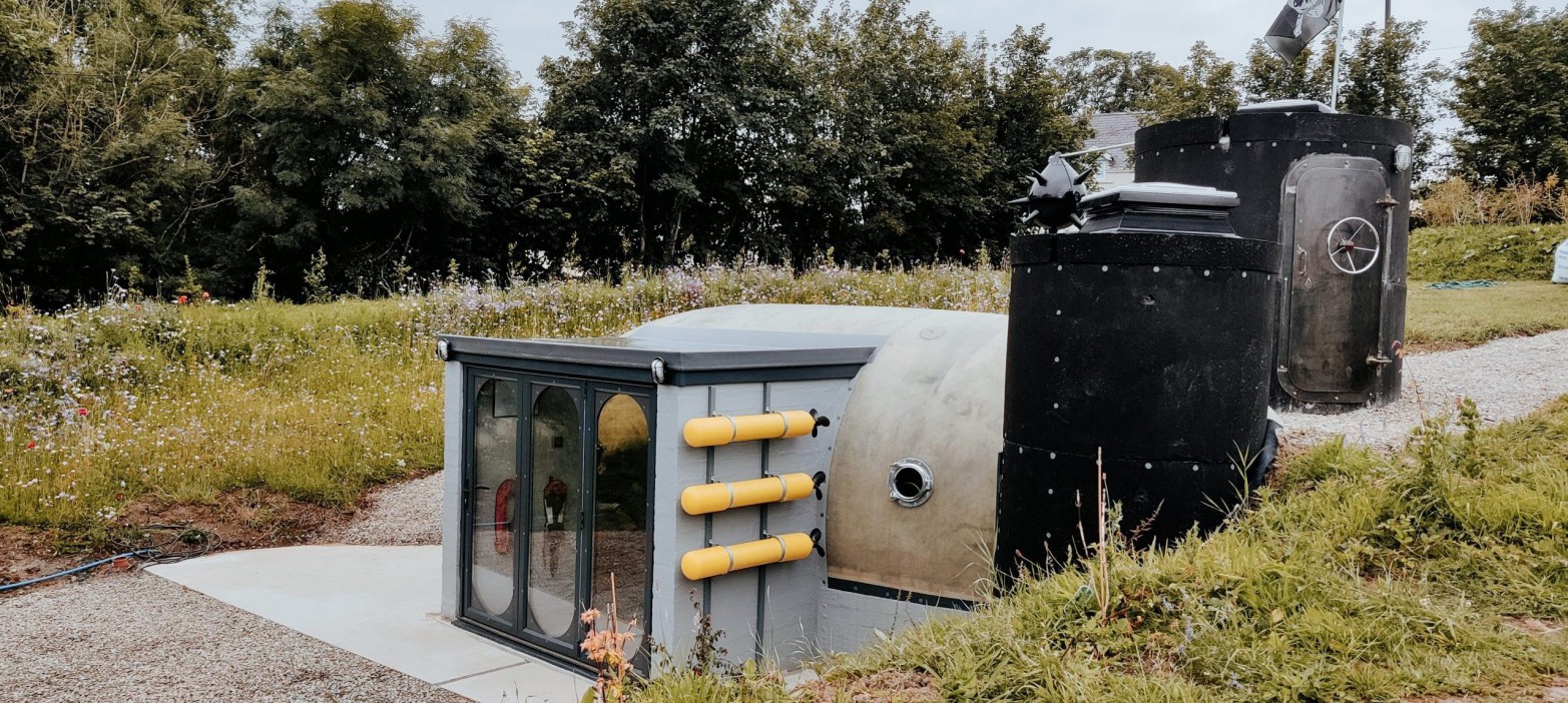 You can stay in a converted submarine in the UK with very unusual shower and triangle-shaped bed