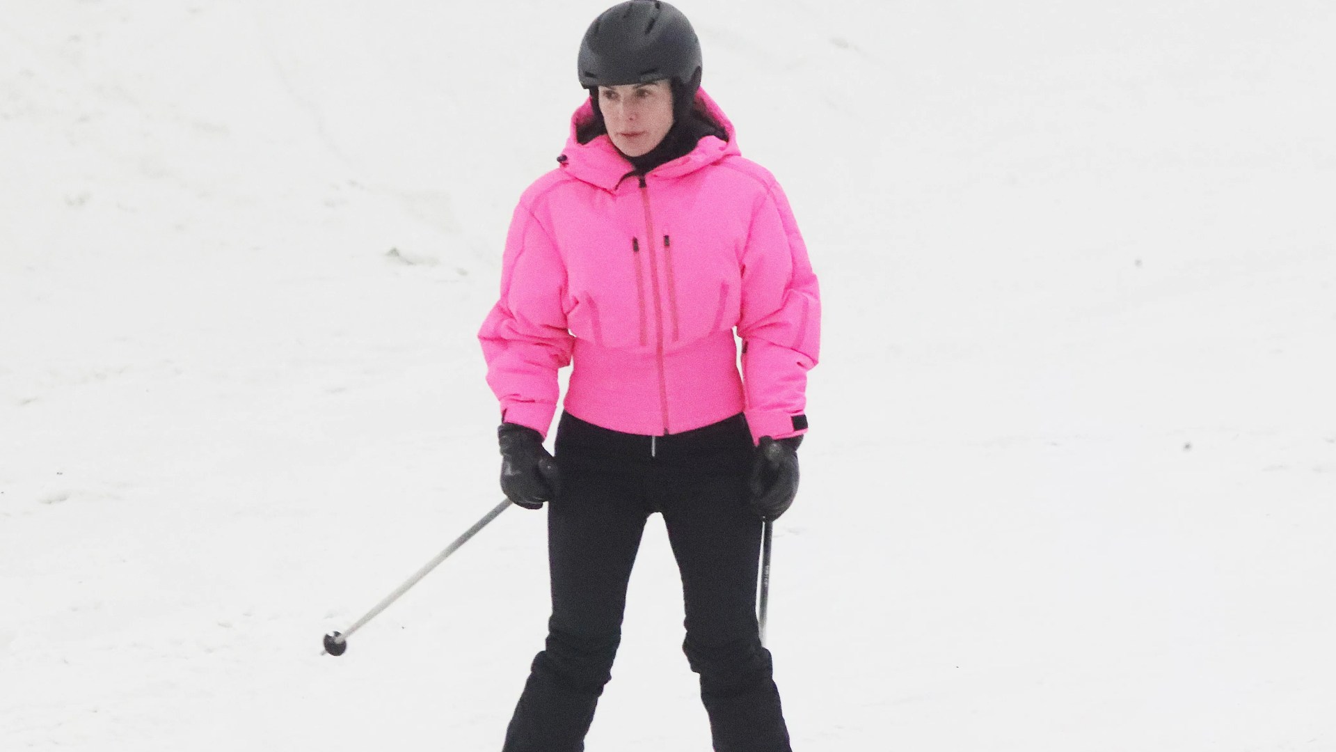 I'm A Celeb star Coleen Rooney dazzles in bright pink coat as she whizzes down indoor ski slope