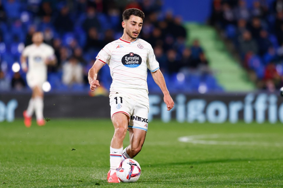 Raul Moro of Real Valladolid dribbling the soccer ball.