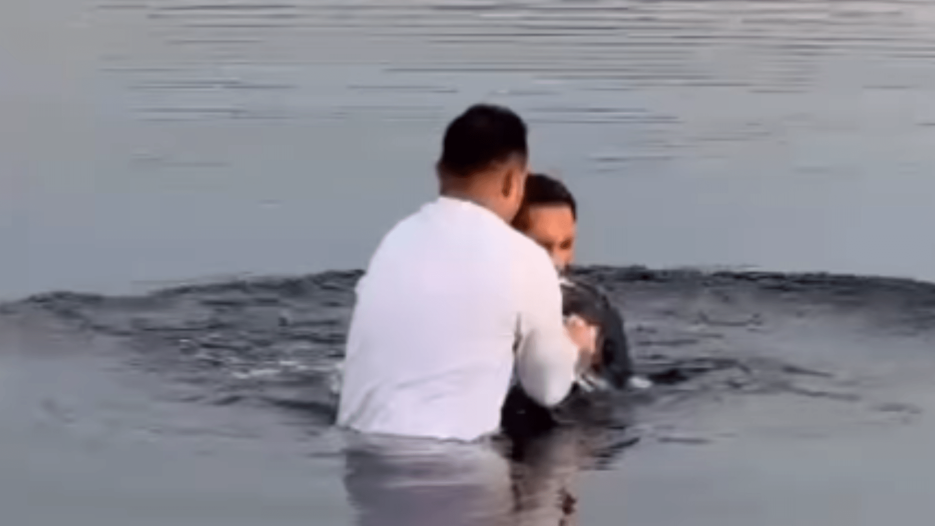 Incredible moment emotional Rangers star gets BAPTISED in freezing cold Scottish loch with Ibrox teammate watches on