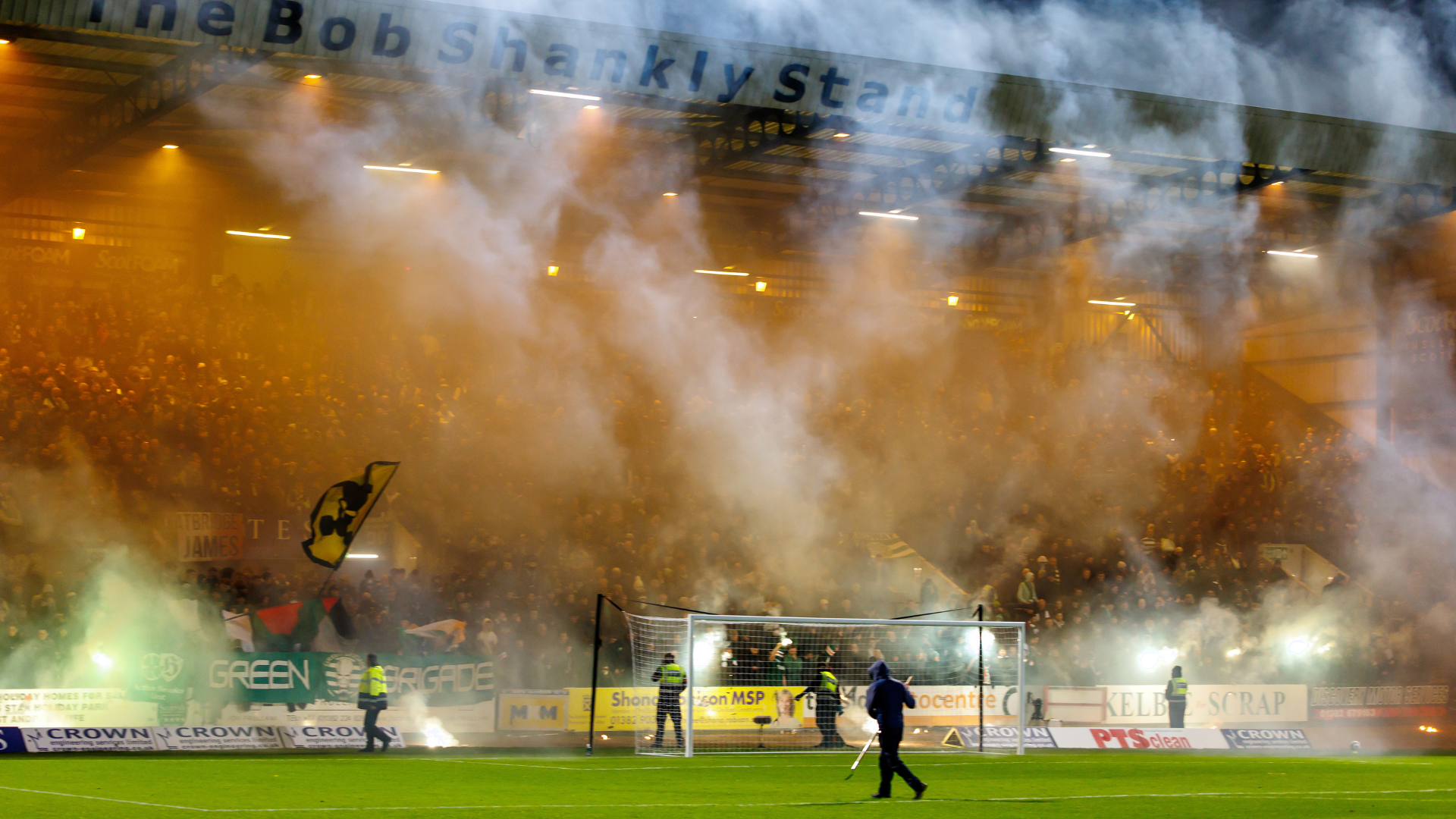 Moment Celtic fans defy pyro warnings before Dundee clash as players walk out to clouds of smoke at Dens Park